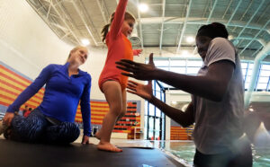 parents support child swim lessons